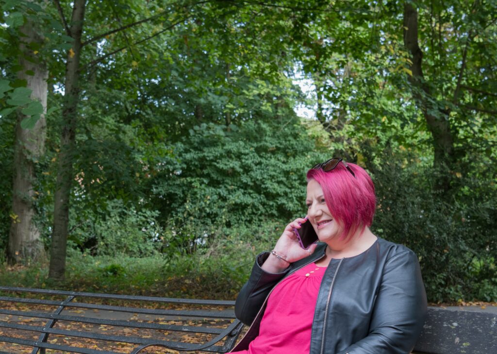 Claire Taylor discussing sales page copywriting with a client by phone